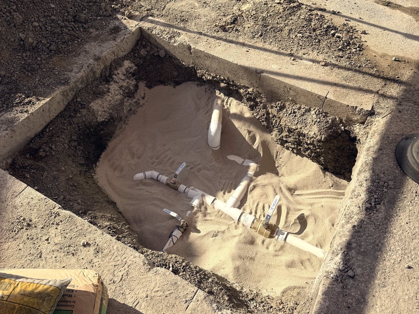 Commercial water service bedded in sand before backfill